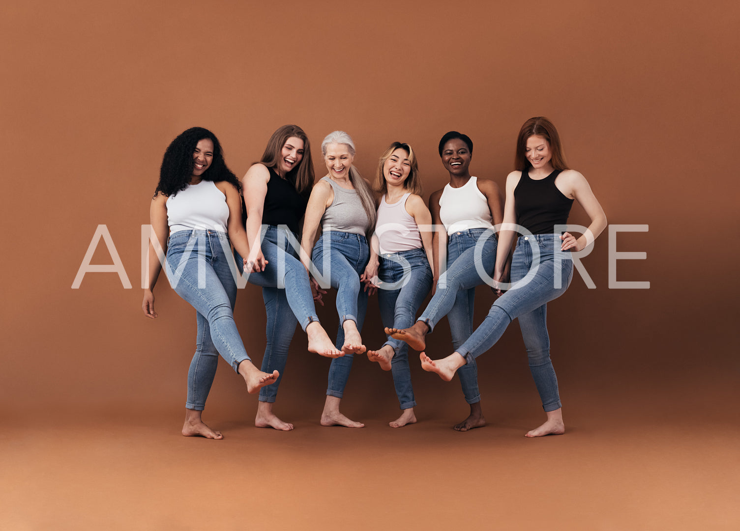 Six multi-ethnic women having fun together against brown background