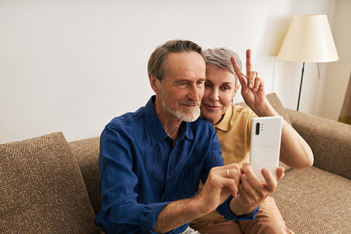 Senior couple taking a selfie. Mature people spending time together and having fun.