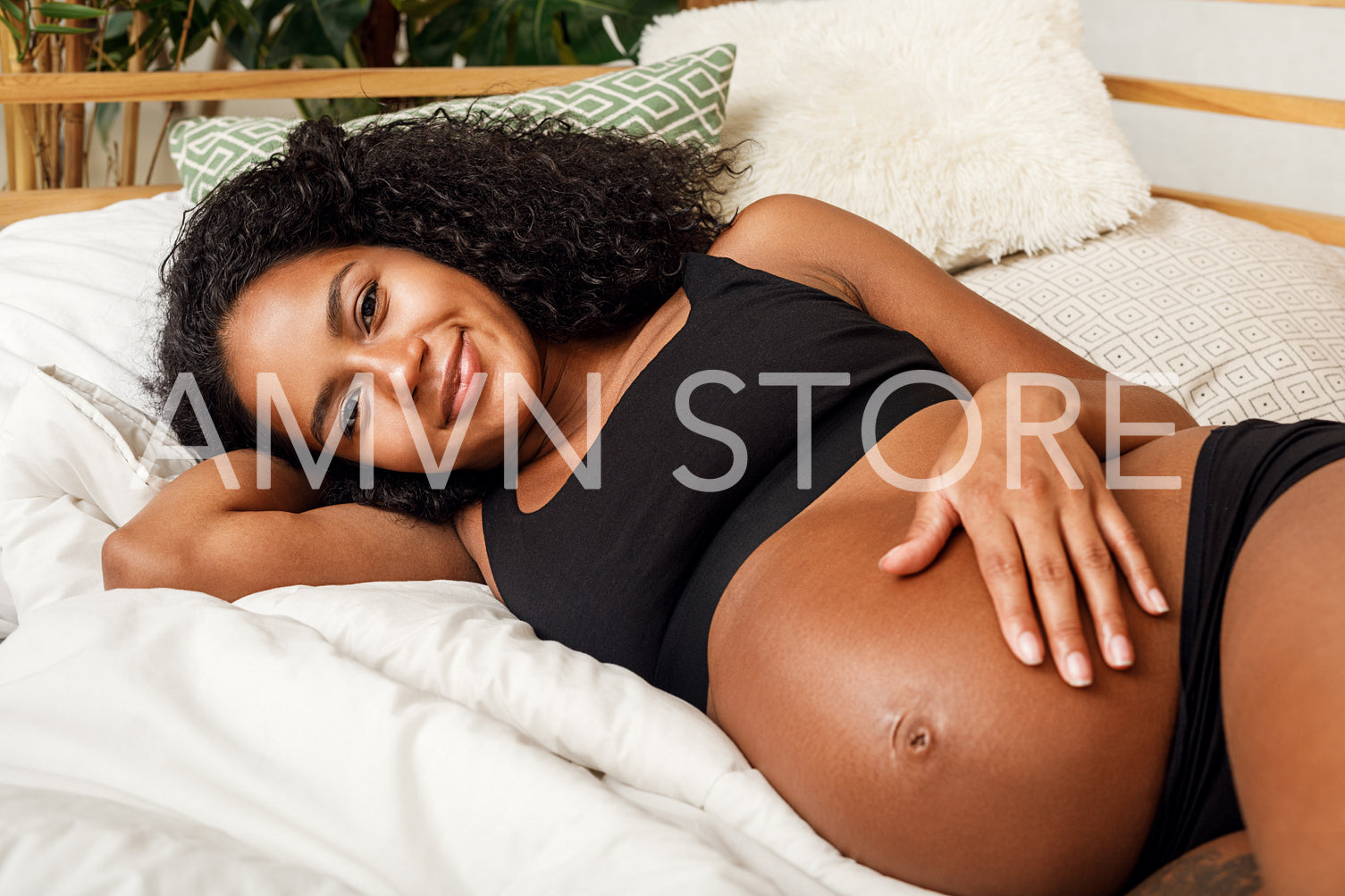 Close up of pregnant woman touching her belly	