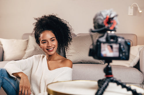 Blogger recording video on dslr camera for her fashion channel