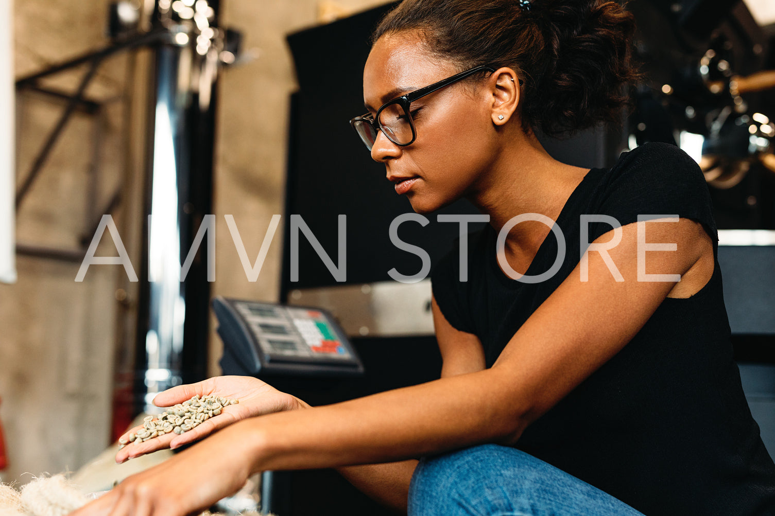 Barista checking quality of green coffee beans in cafe	