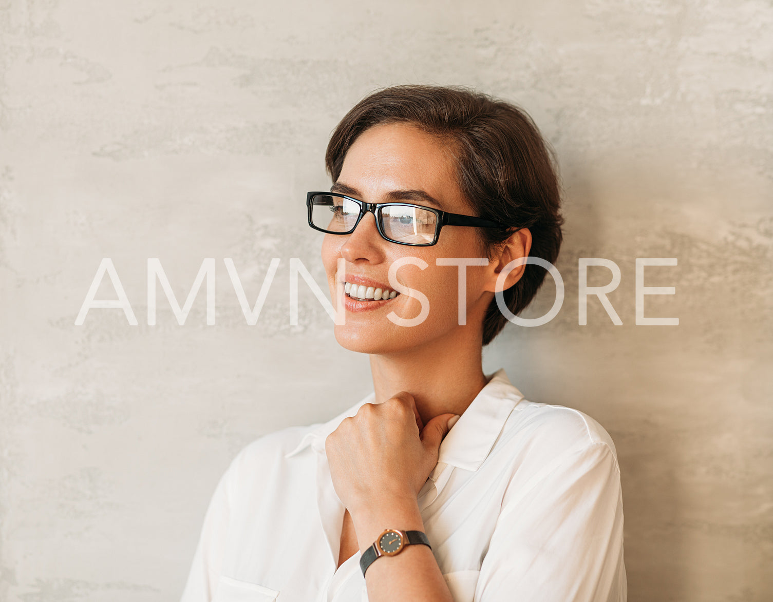 Confident businesswoman in eyeglasses in formal white clothes