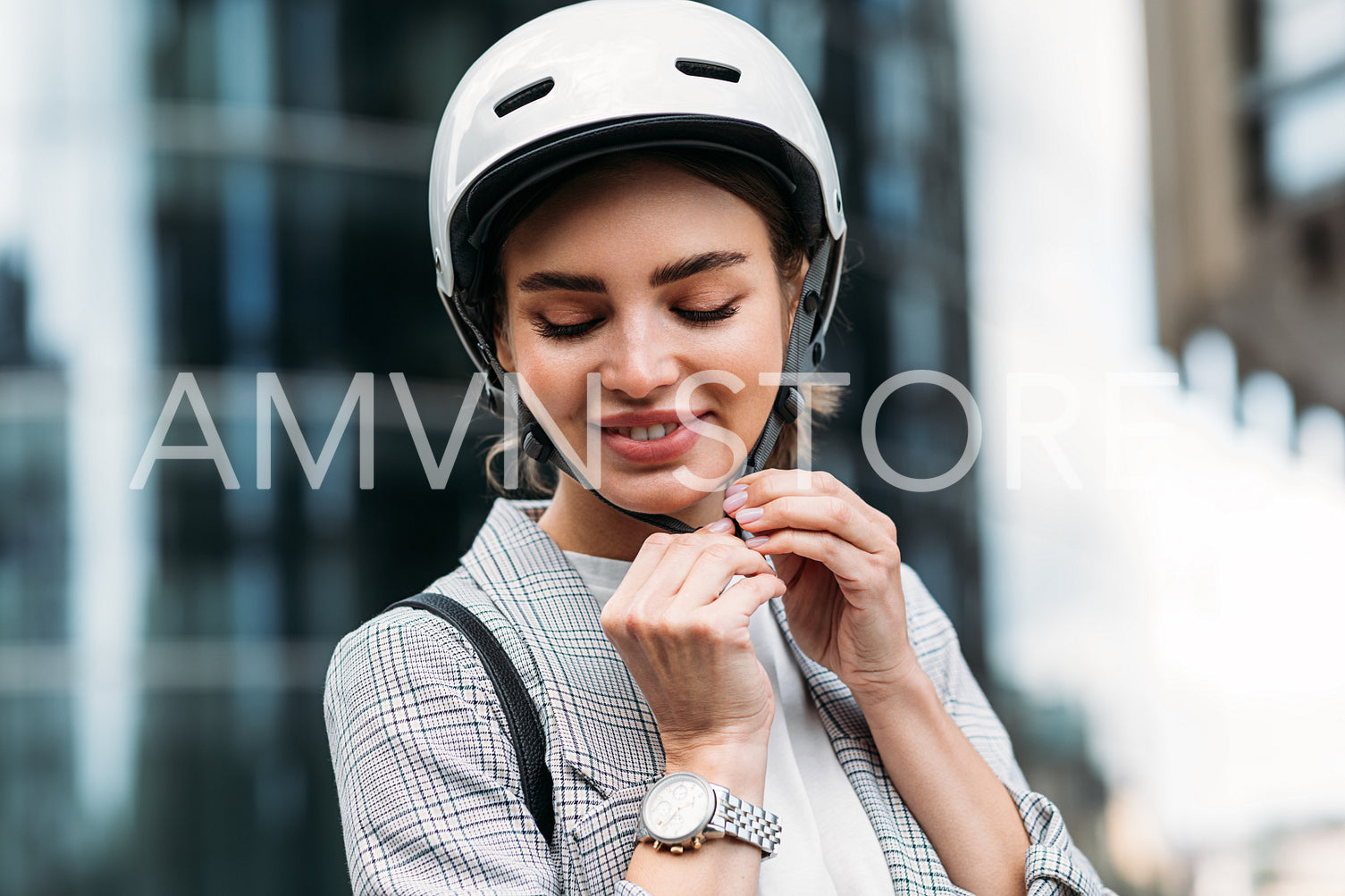 Cheerful caucasian woman wearing white cycling helmet preparing for ride