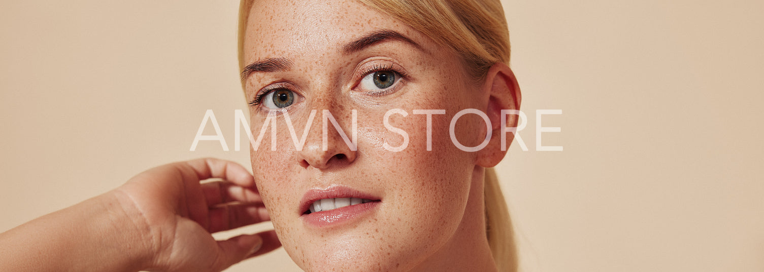 Cropped shot of a young beautiful blond woman with freckles. High-detailed portrait of a female with smooth freckled skin against a pastel backdrop.