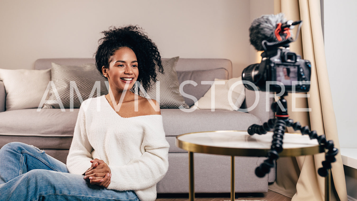 Smiling woman creating video content for her blog	