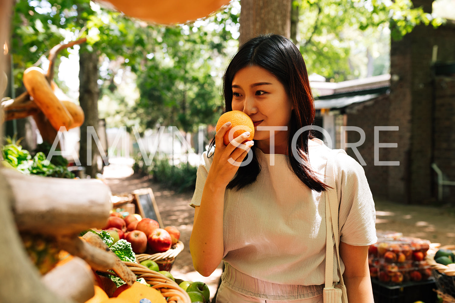 Asian woman with orange