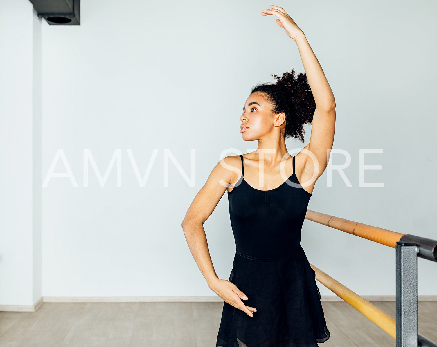 Woman in dancewear practicing hand moves in the ballet studio	