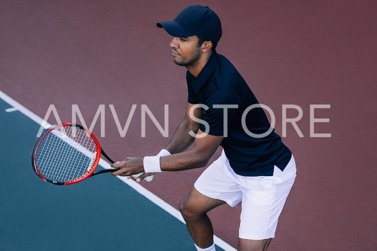 Tennis player on a hard court. Professional tennis player preparing to return the serve.