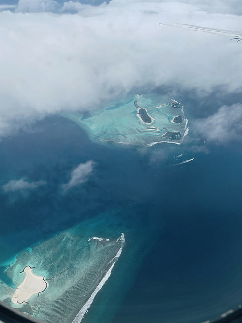 View from airplane on a tropical islands in ocean